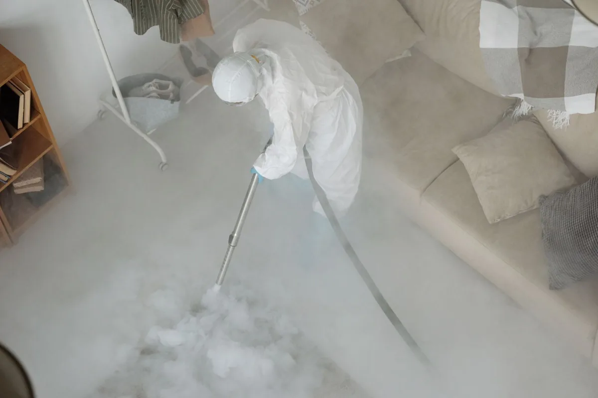 Biohazard cleanup technician in protective equipment, Pitman, NJ